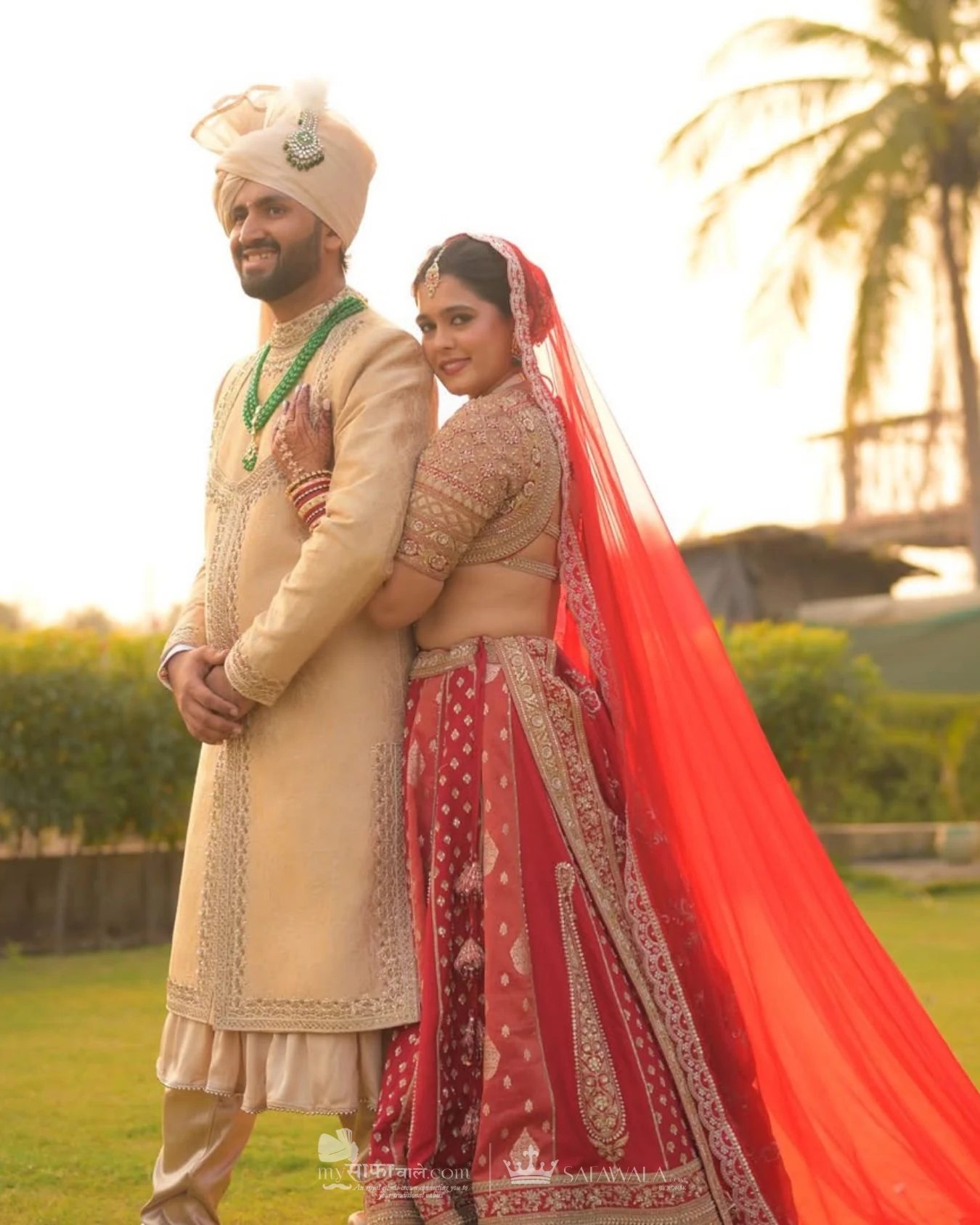 Classic groom pagdi styled with a red ceremonial stole for Awas